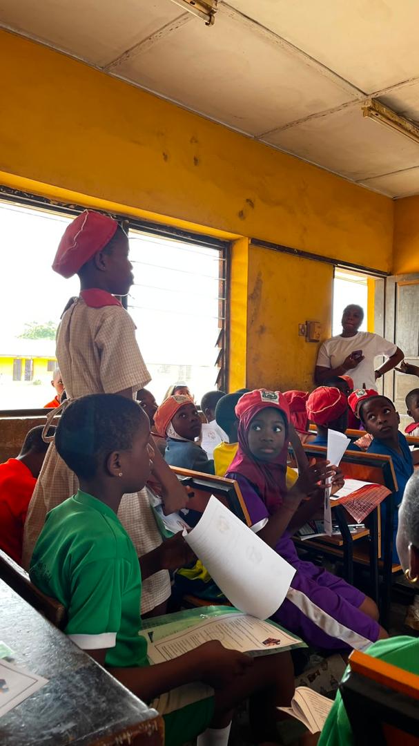 Girls receiving empowerment materials at HHF school programme